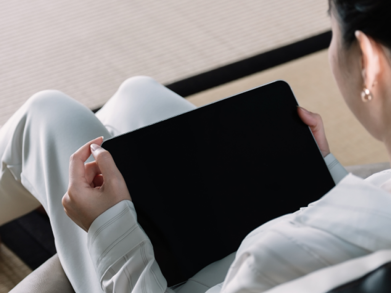 above-view-of-woman-using-smart-tablet-at-home-2022-08-18-17-58-48-utc 1.png